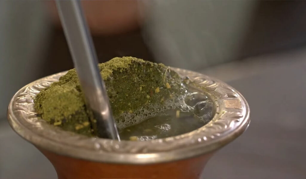 Chimarrão, traditional yerba mate tea, on the table. Yerba mate tea, a  typical drink from southern Brazil, Argentina, Uruguay and Paraguay. An  infusion of Yerba Mate (IIex paraguariensis). Stock Photo